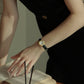 นาฬิกาสายหนังสีดำสำหรับผู้หญิง Crystal deco รูปทรงวงกลม Bloom Gold